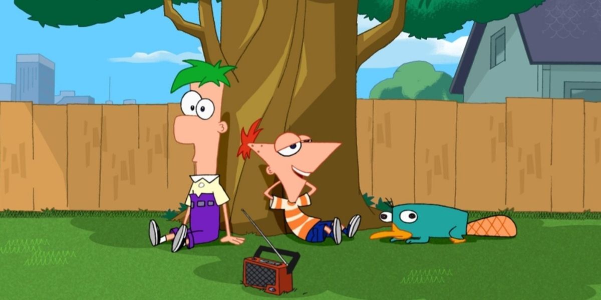 Phineas and Ferb sitting under a tree with Perry the Platapus