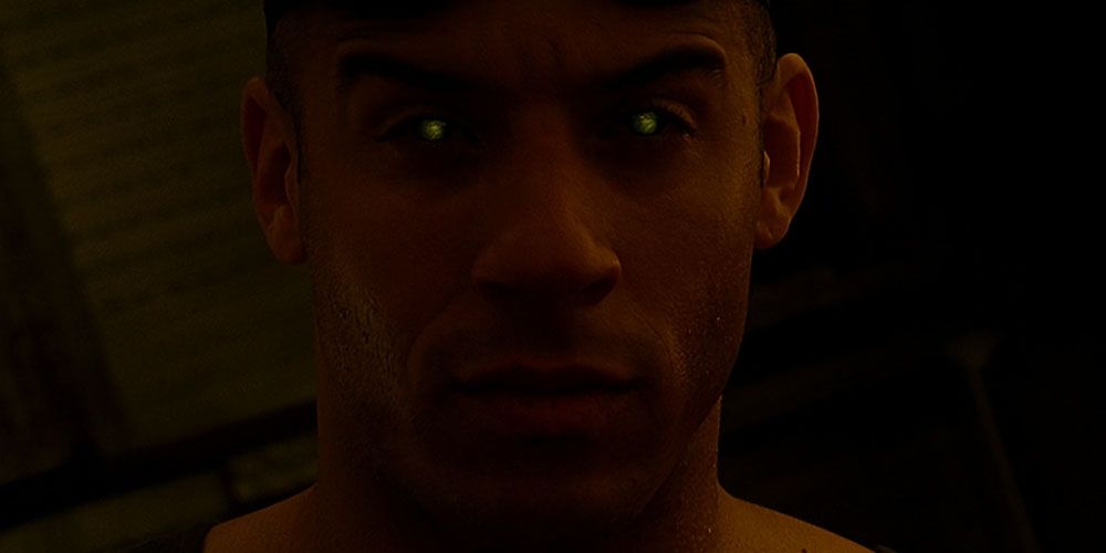 Riddick watching the bioraptors with glowing eyes in Pitch Black