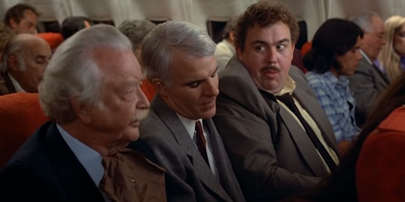 Neal et Del dans un avion dans Planes, Trains & Automobiles.