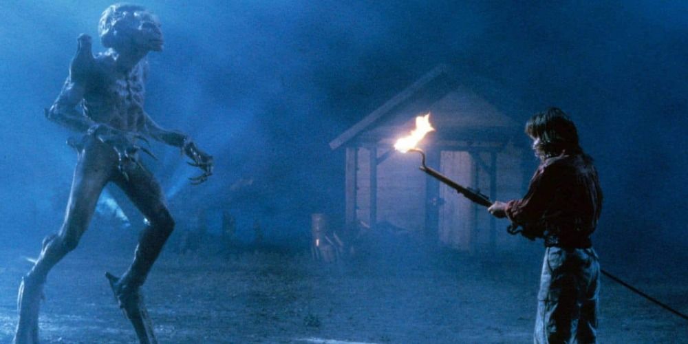 Someone facing off against the Pumpkinhead monster in Pumpkinhead (1988)