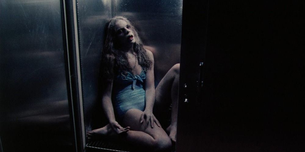 A woman's lifeless body stored inside a freezer in a still from Rabids