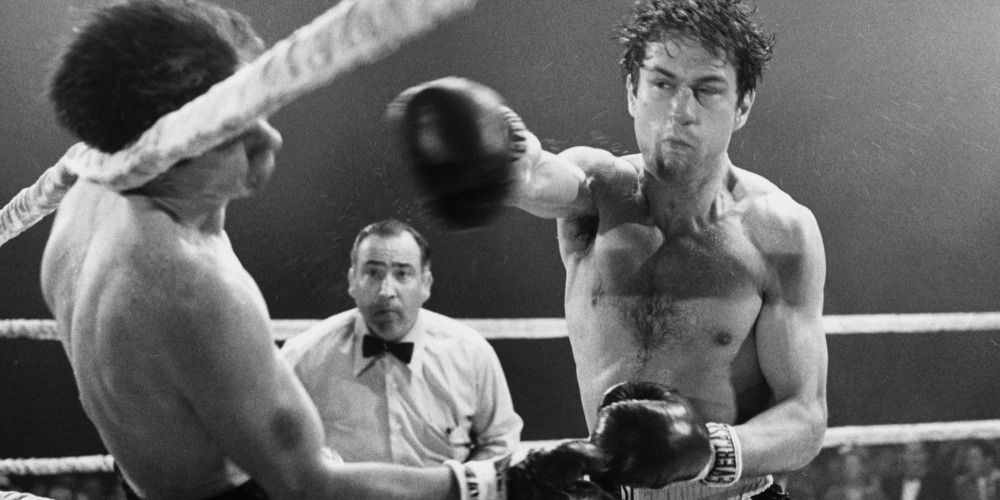 Robert De Niro punching an opponent in Raging Bull (1980)