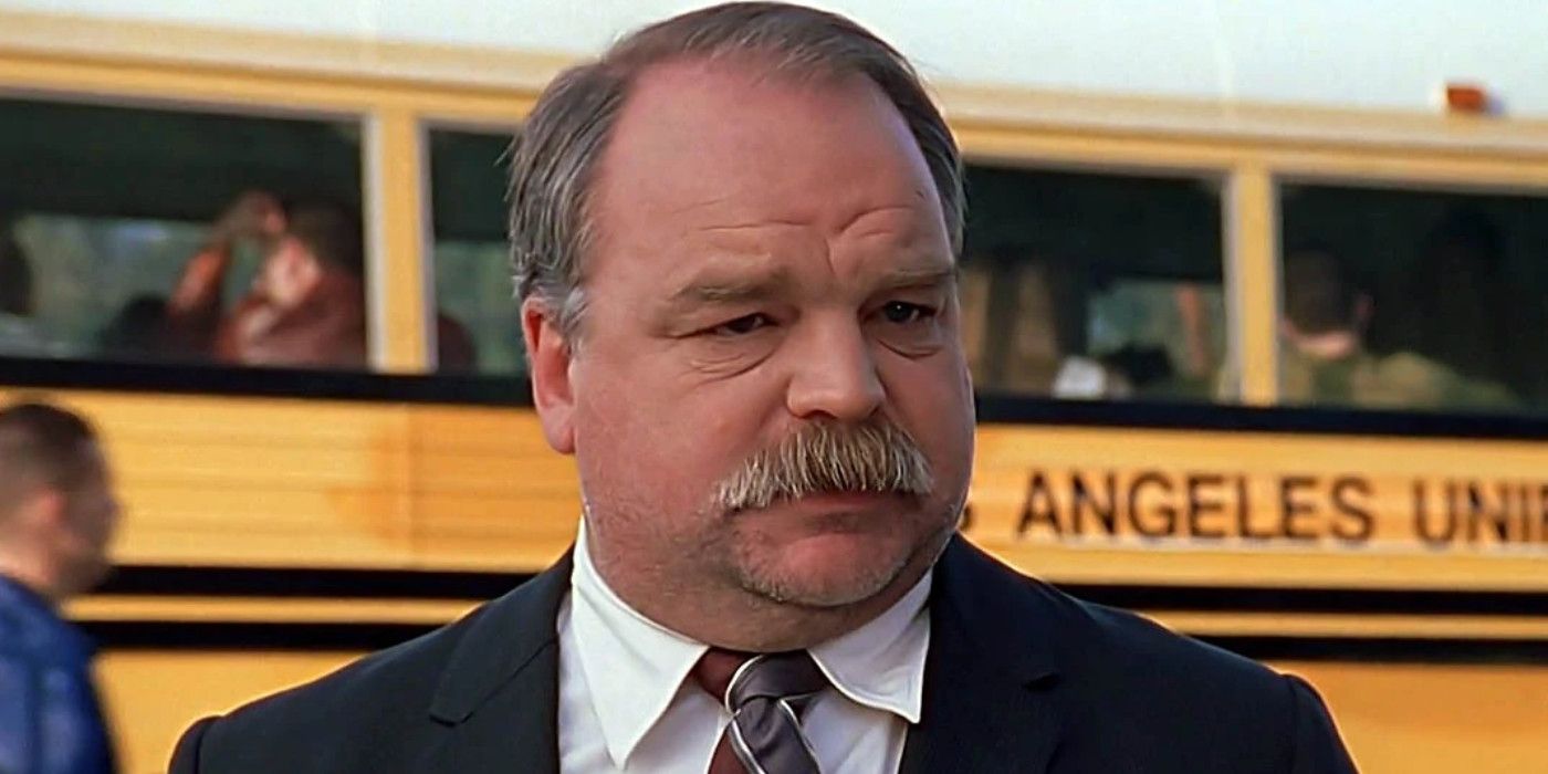 Merrick Jamison-Smythe issues orders in front of a school bus in Buffy the Vampire Slayer