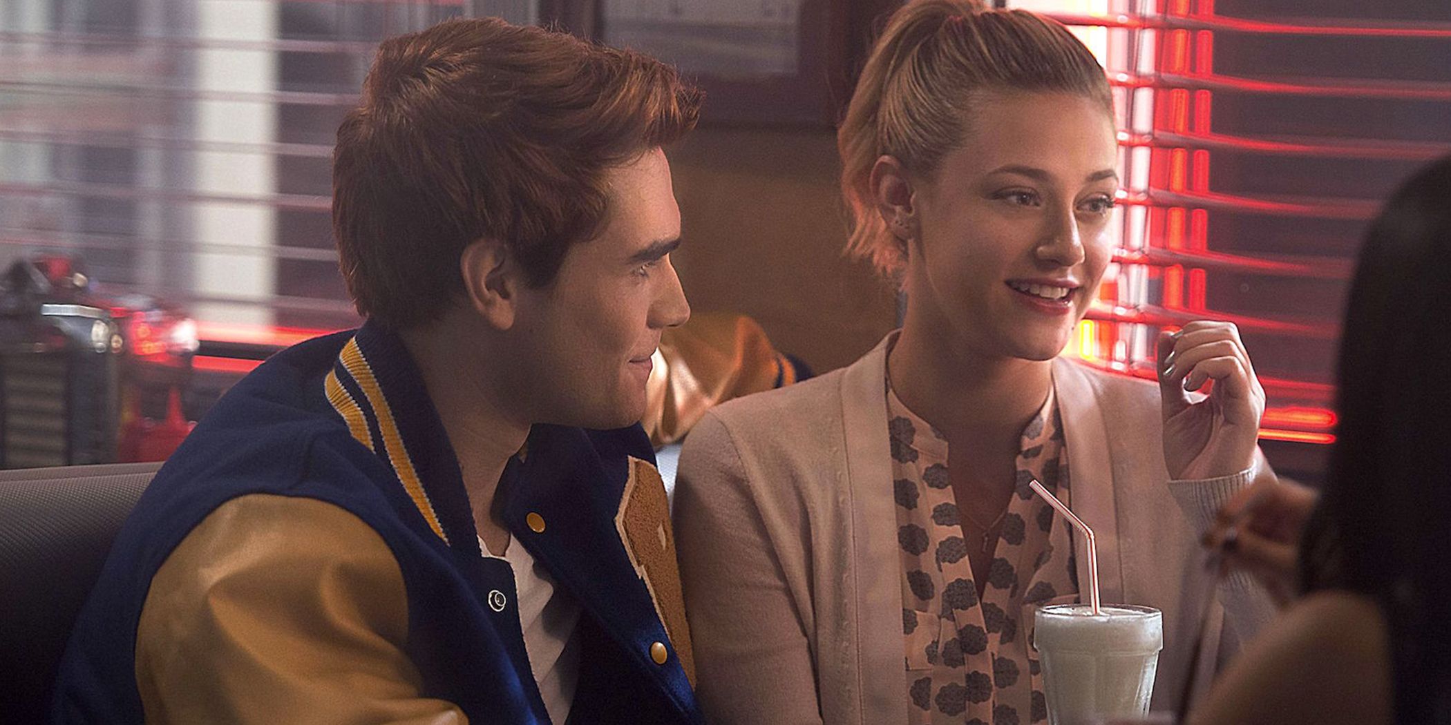 Betty and Archie sit together at Pop's diner