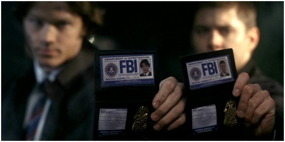 Sam and Dean showing fake IDs in Supernatural