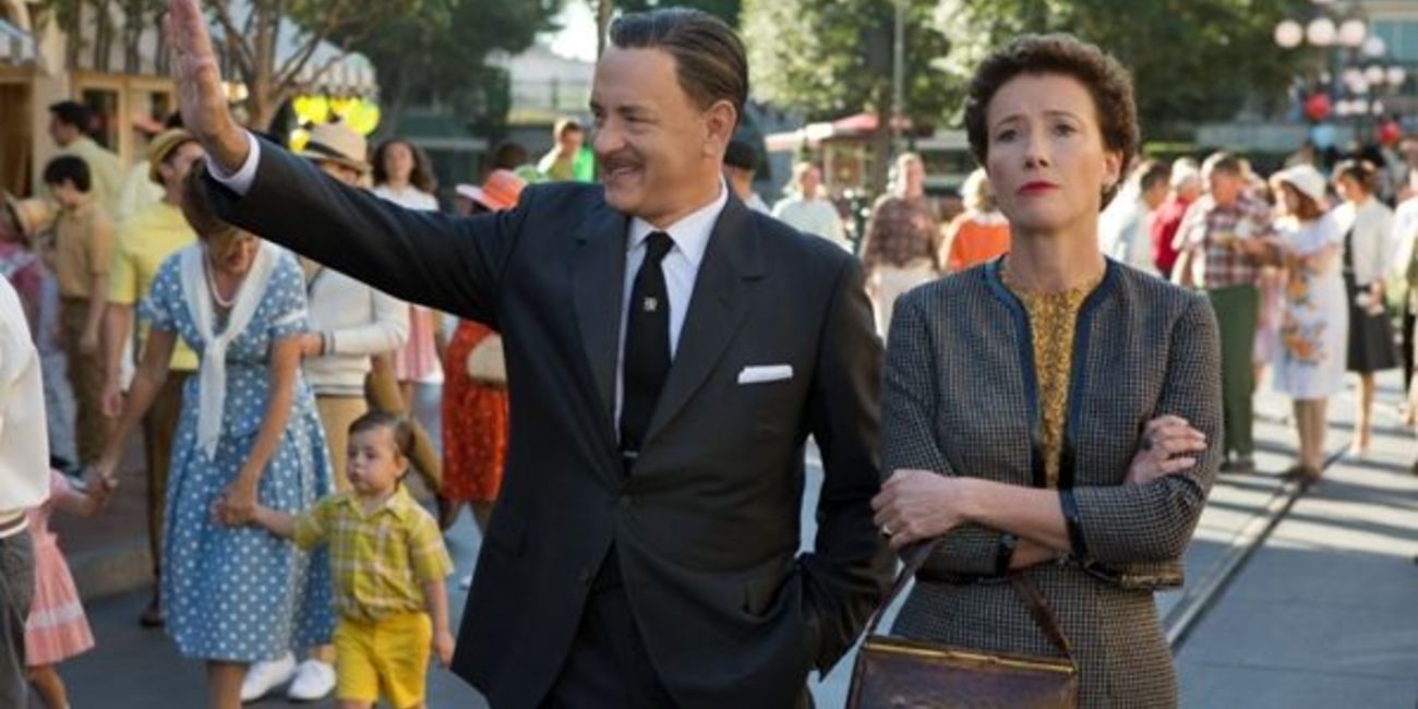 Walt Dsiney waves at a crowd as he passes by in Saving Mr. Banks