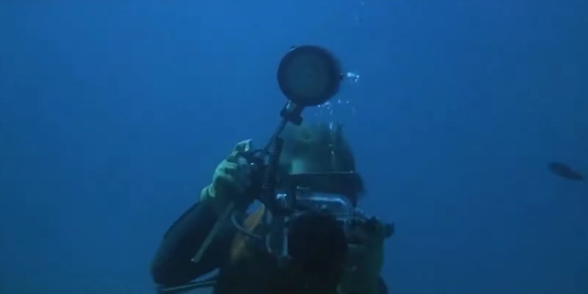 Scuba diver taking pictures underwater in Jaws 2