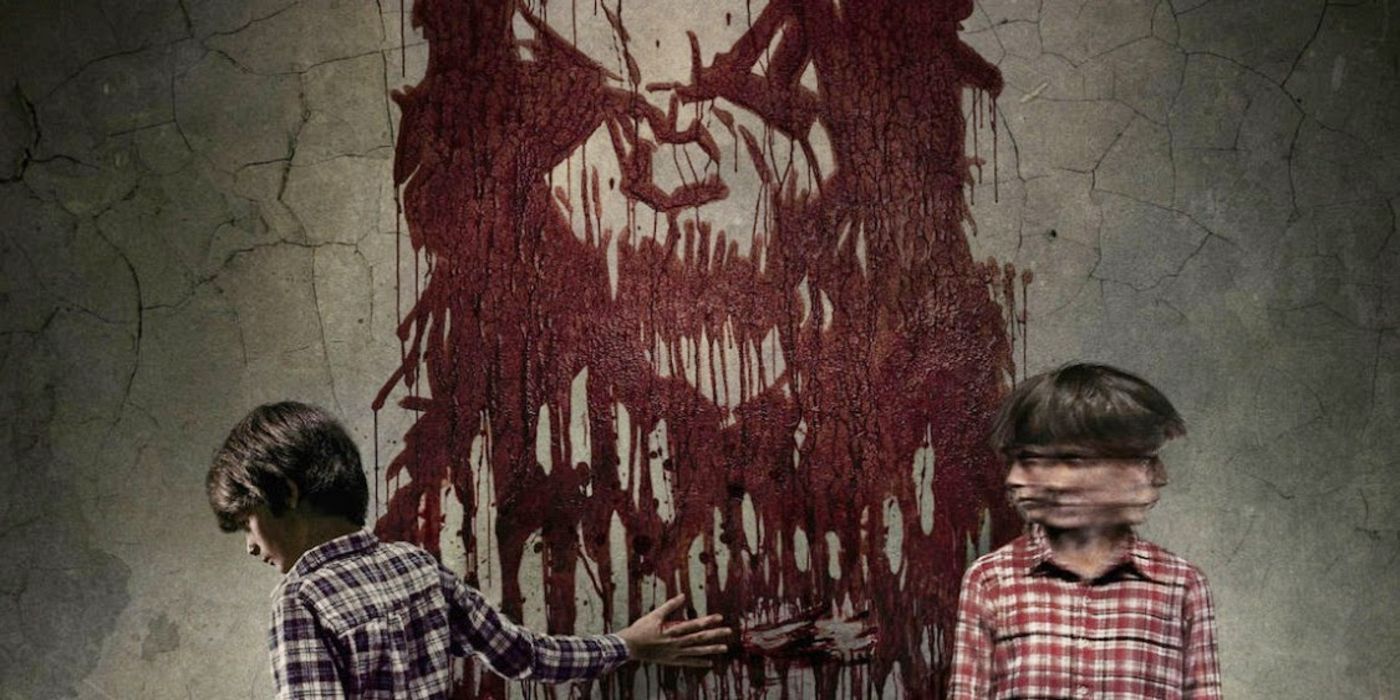 Poster for the movie Sinister with two children and a bloody image on a wall.