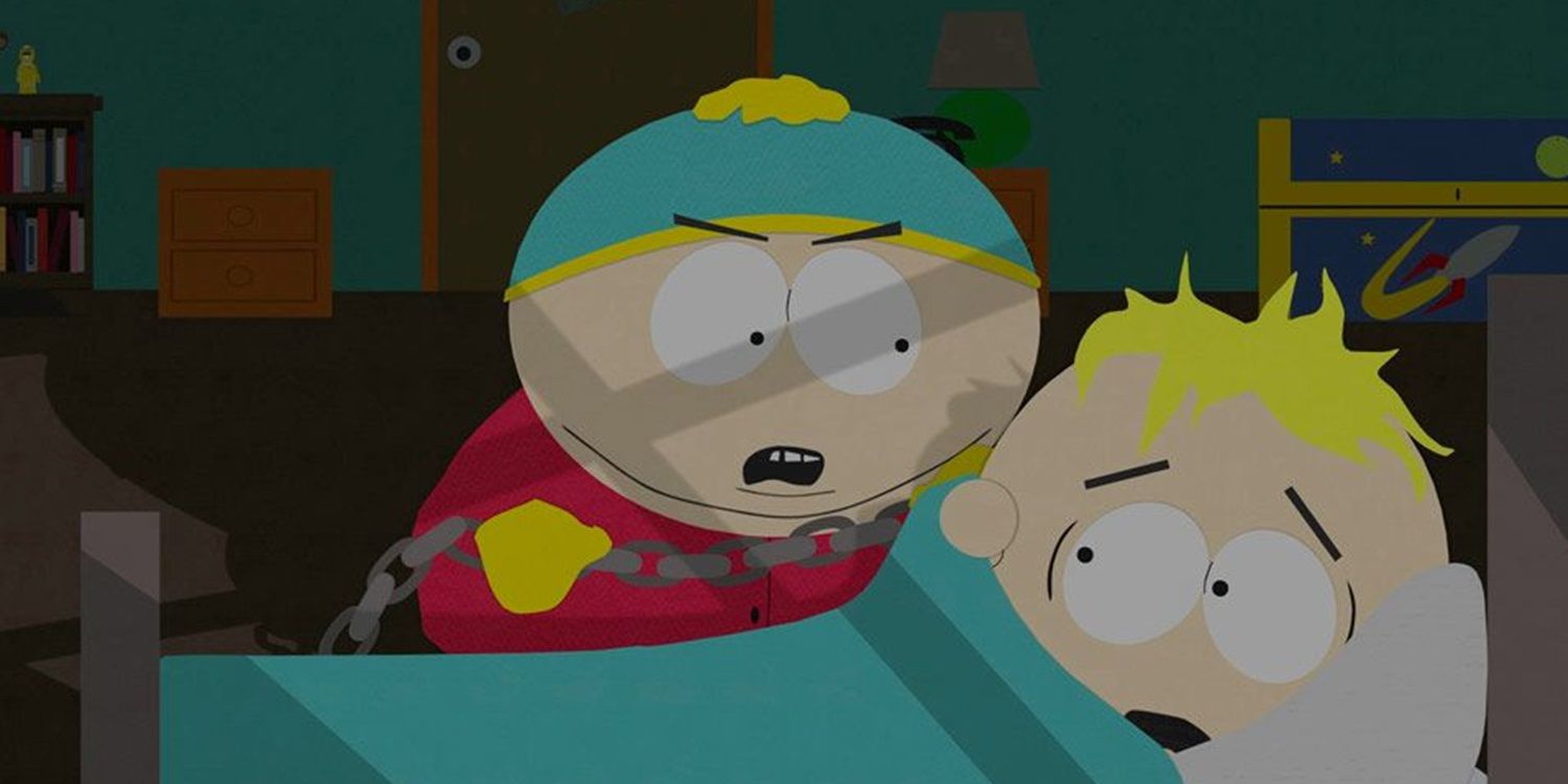 Cartman angrily pointing at Butters who is hiding under his blanket in South Park.