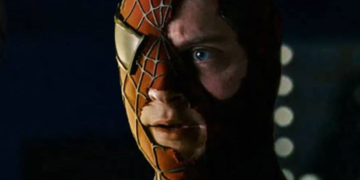 An image of Peter wearing a torn Spider-Man mask in Raimi's Spider-Man