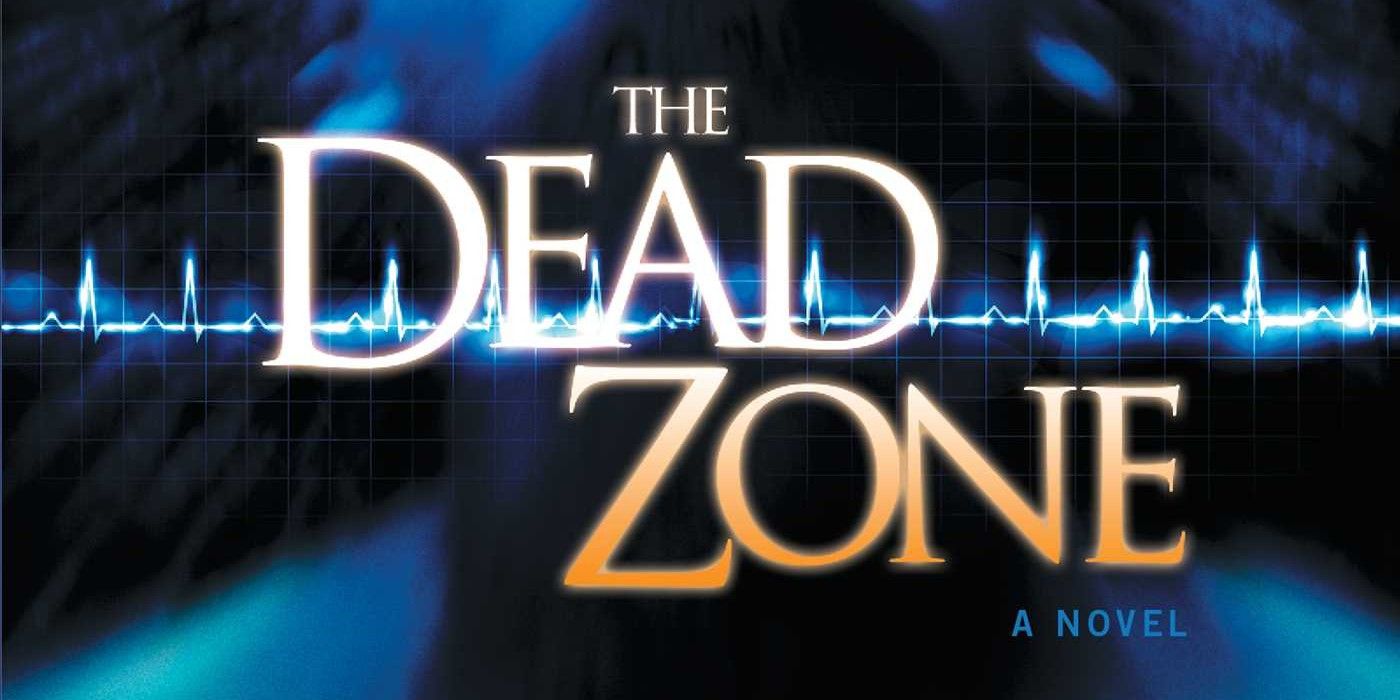 The cover of The Dead Zone by Stephen King featuring the title in yellow and orange and a blue background