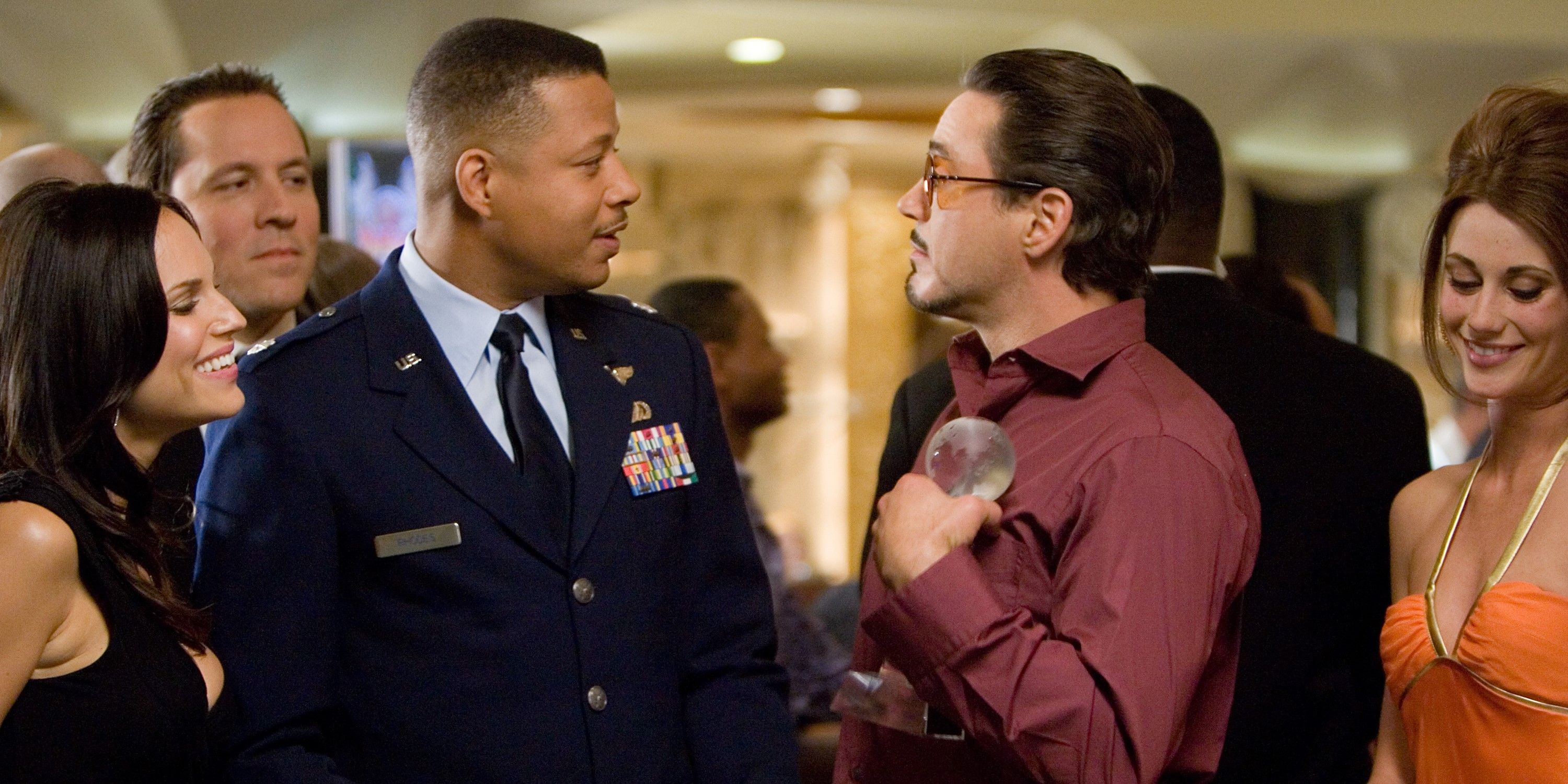 Terrence Howard and Robert Downey Jr talking in Iron Man