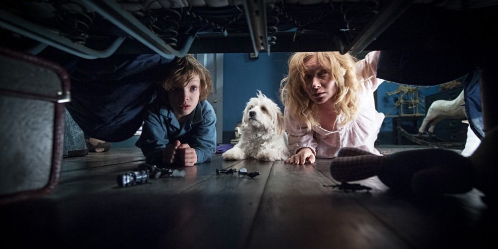 Amelia, Samuel and the dog looking under the bed in The Babadook (2014)