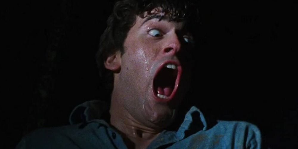 Bruce Campbell as Ash screaming in the dark in The Evil Dead (1981) by Sam Raimi