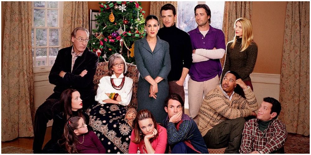 Mixed Family In Front Of Christmas Tree