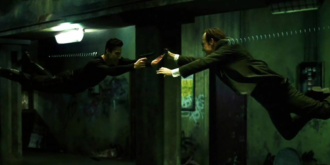 Neo and Agent Smith shoot at each other mid-air in The Matrix