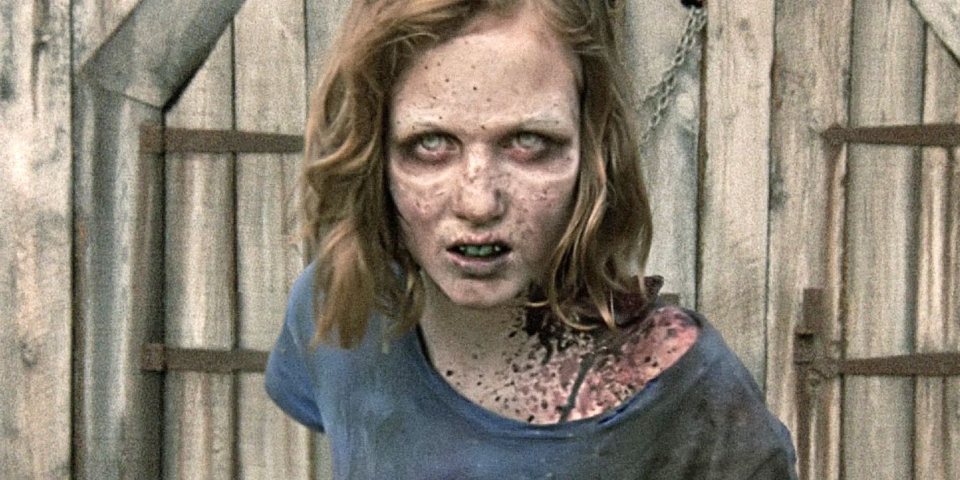 Sophia stands in front of a wooden door after being turned into a walker. 