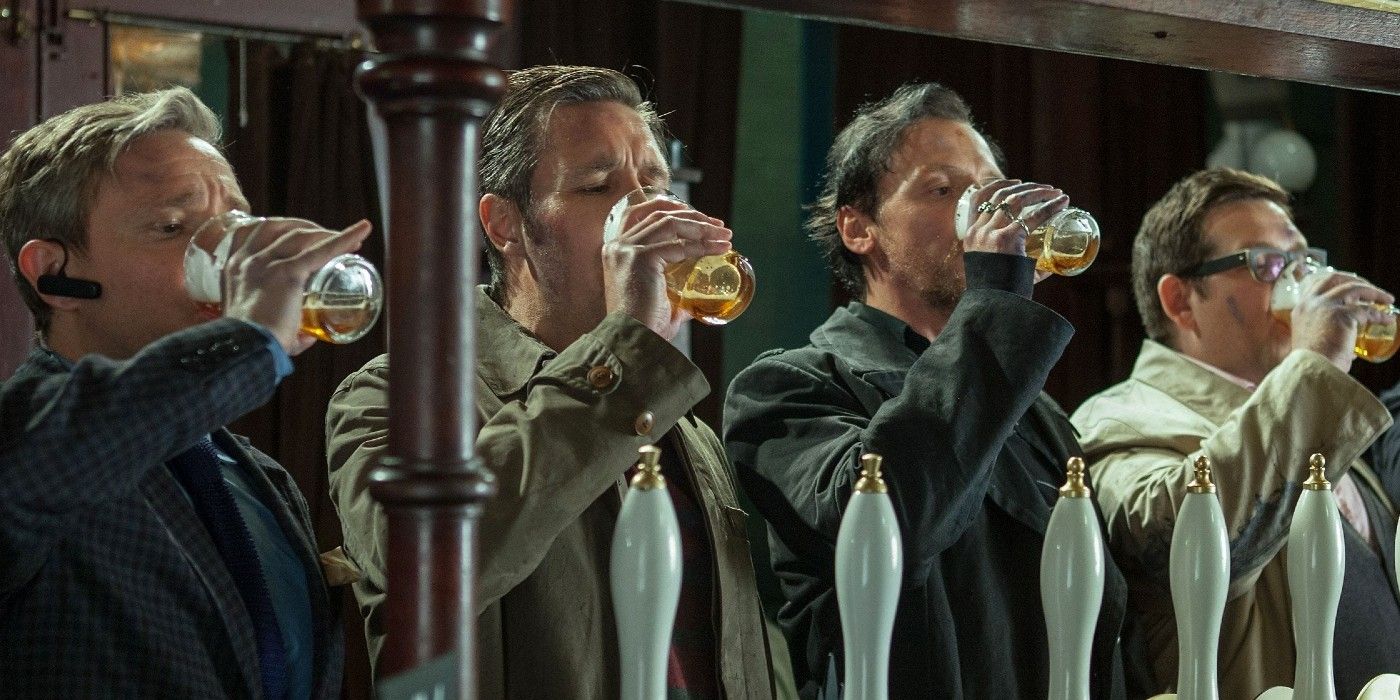 Gang chugs their beers at a pub in The World's End