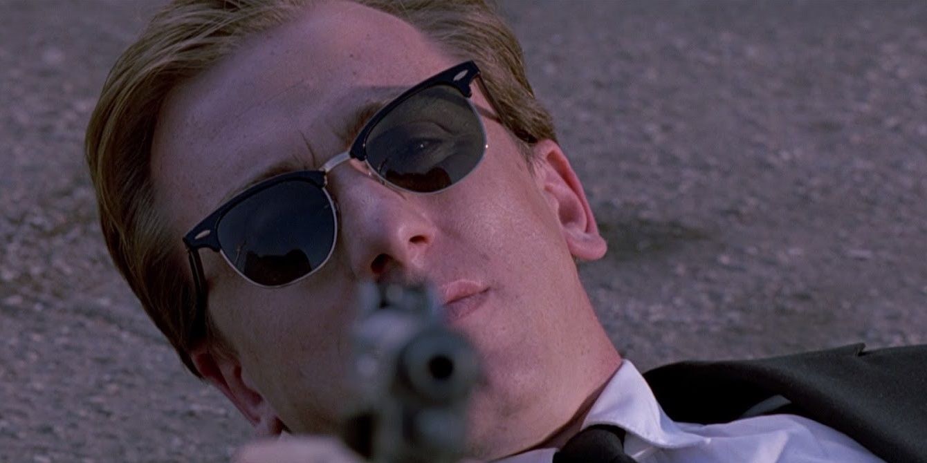 Tim Roth holding a gun in Reservoir Dogs