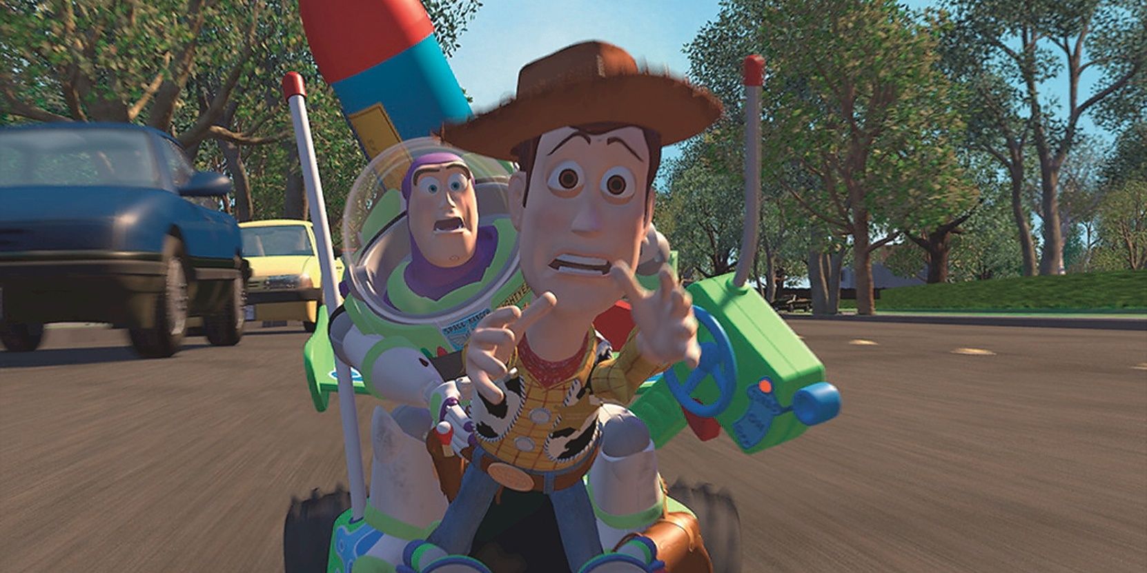 Woody and Buzz ride a toy car to catch up with Andy's moving truck