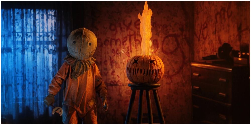 Halloween Creature In Front Of Pumpkin On Fire