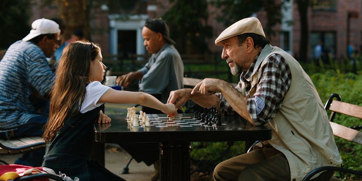 Two characters playing chess in A Little Game in the park