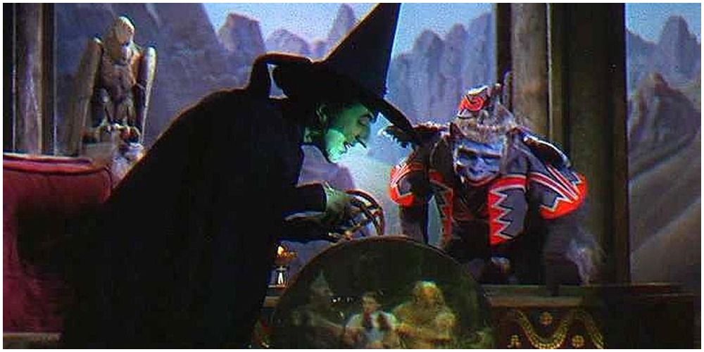 Wicked Witch And Flying Monkey Looking Into Crystal Ball