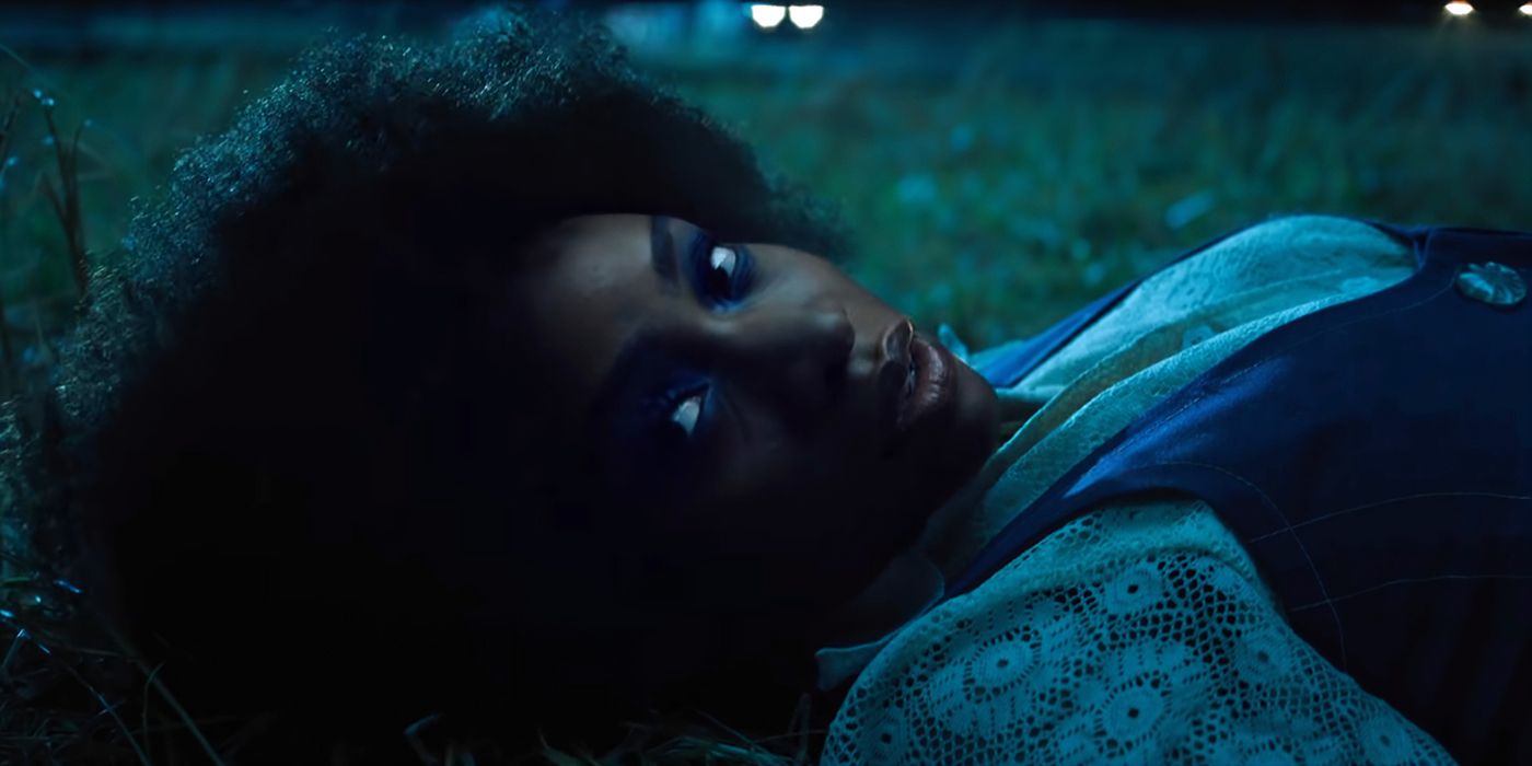 Monica Rambeau lying on the grass and looking to the camera in WandaVision