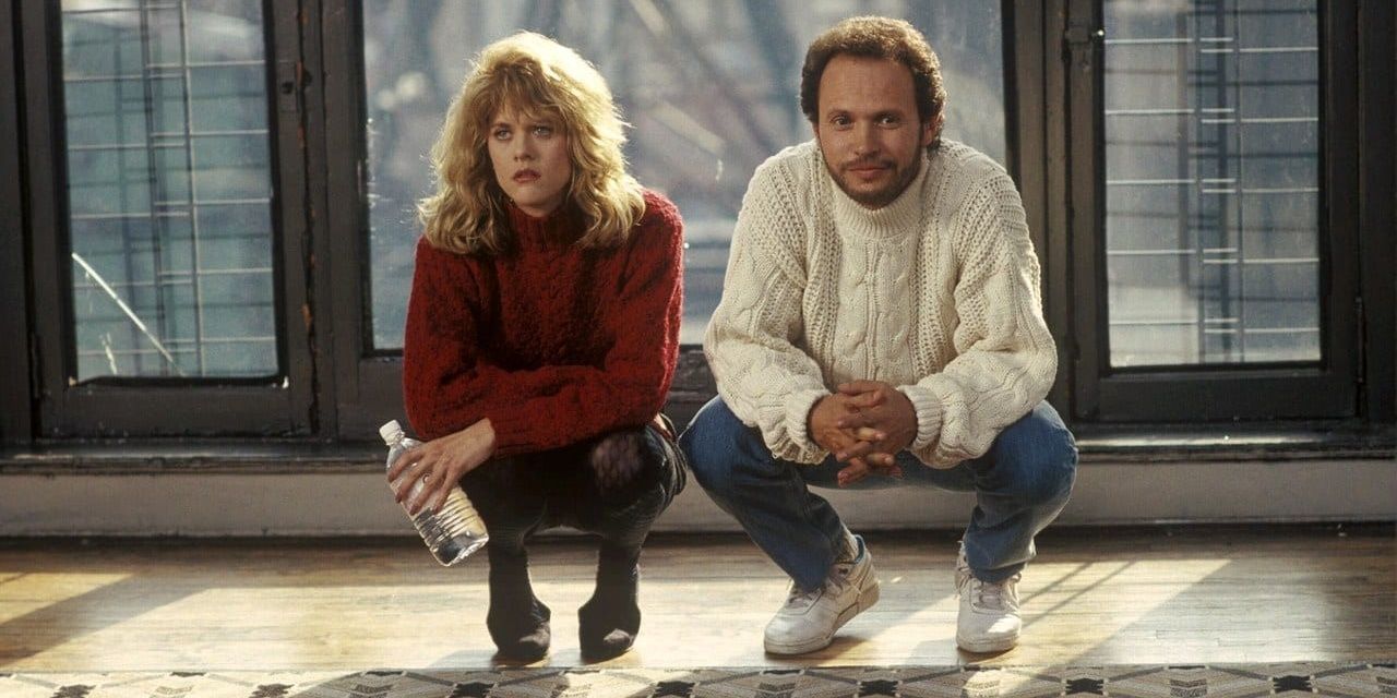 Sally and Harry crouching down in an apartment in When Harry Met Sally