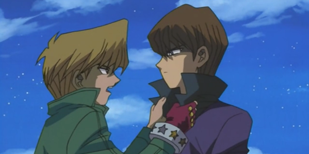 Joey grabs Kaiba by the neck of his coat