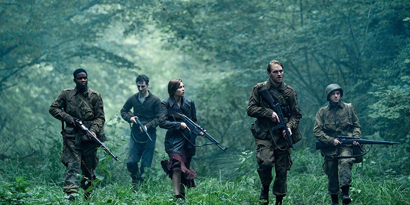 A group of WWII soldiers walking through a forest in Overlord.