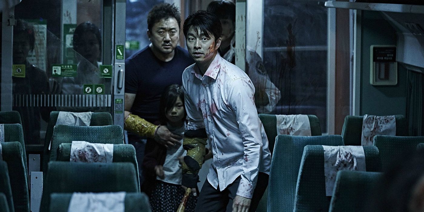 Human survivors making their way cautiously through a train in Train to Busan