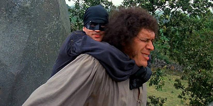Fezzik (André The Giant) carrying Westley on his back in The Princess Bride