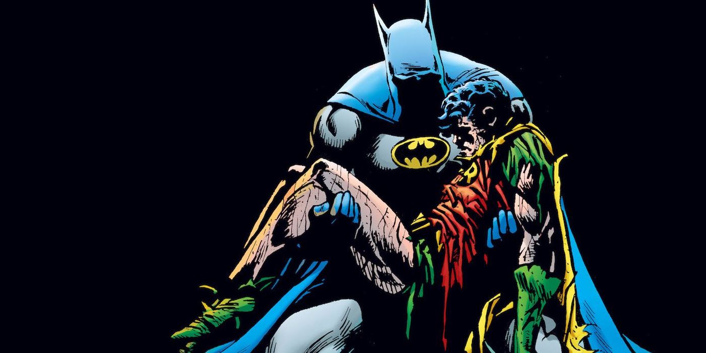 Batman holding Jason Todd in DC Comics