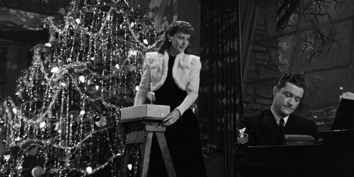 Barbara Stanwyck looks down from a Christmas tree in Christmas in Connecticut