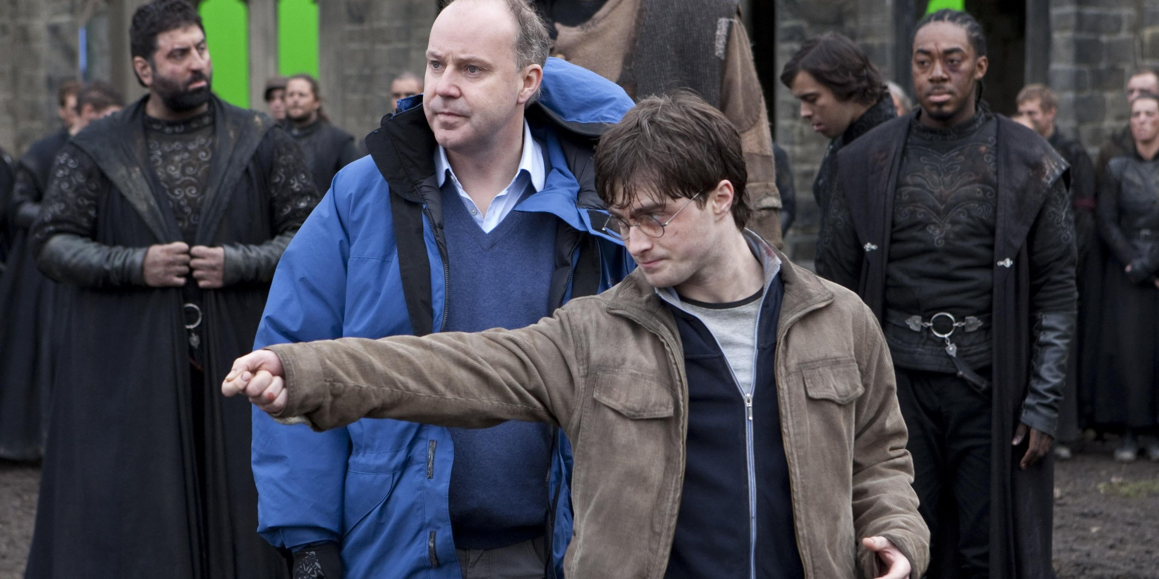david yates directing Daniel Radcliffe holding his hands up 