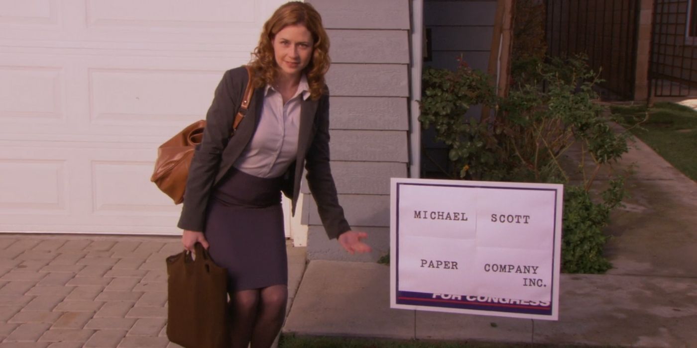 Pam stands in front of the Michael Scott Paper Company sign on The Office