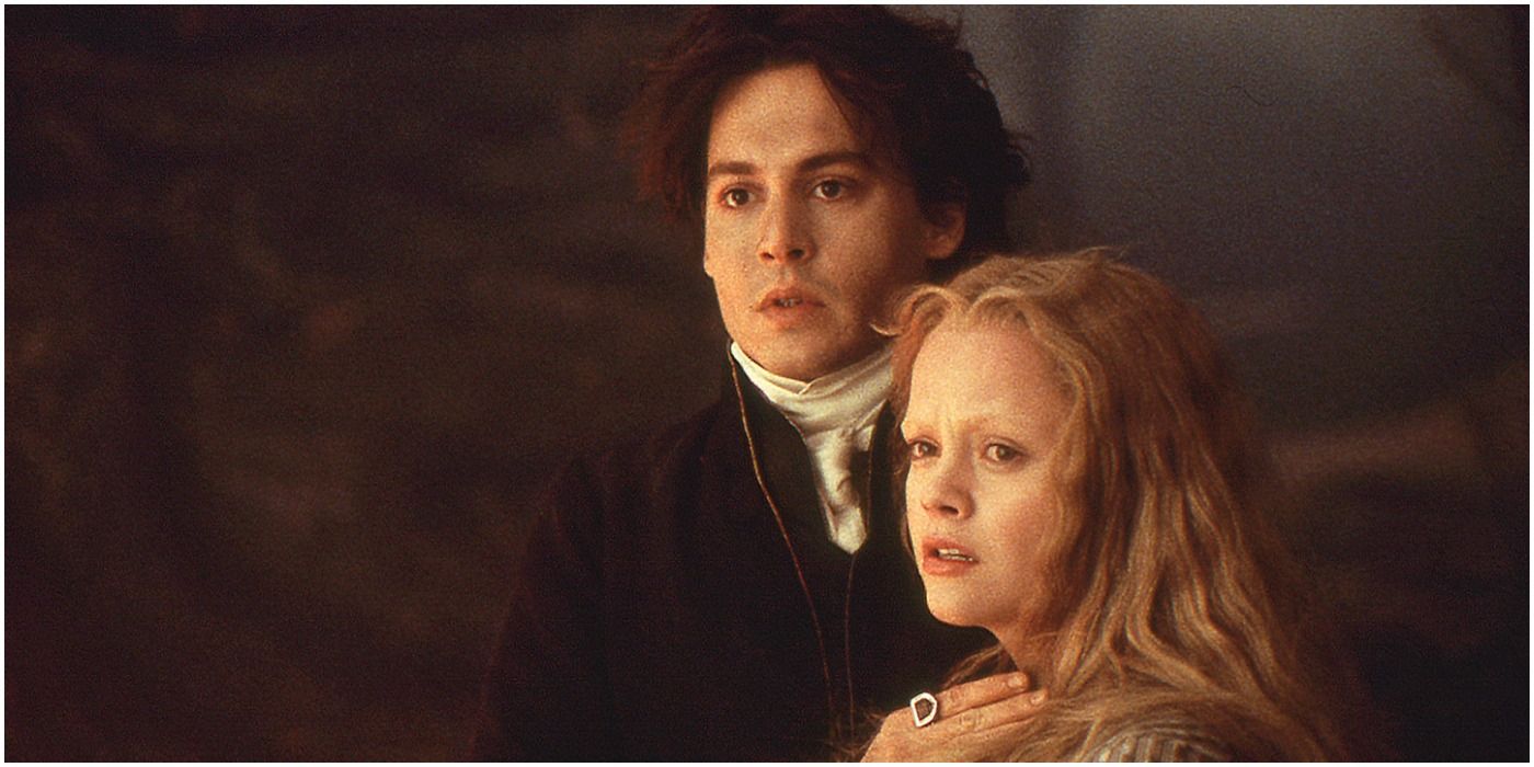 Ichabod and Katrina embrace and look in horror at somethin in Sleepy Hollow