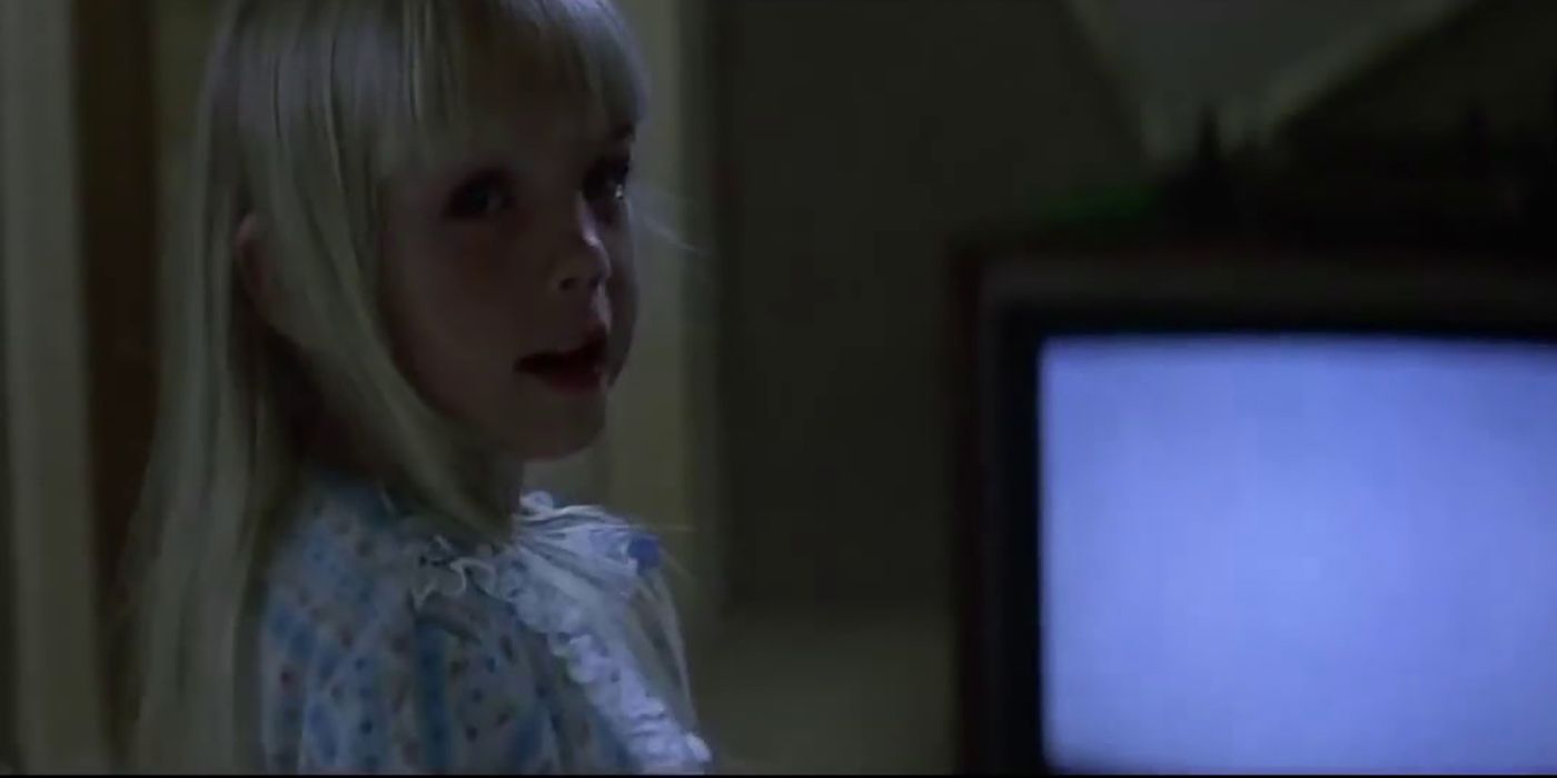 Carol Anne in front of the television in Poltergeist