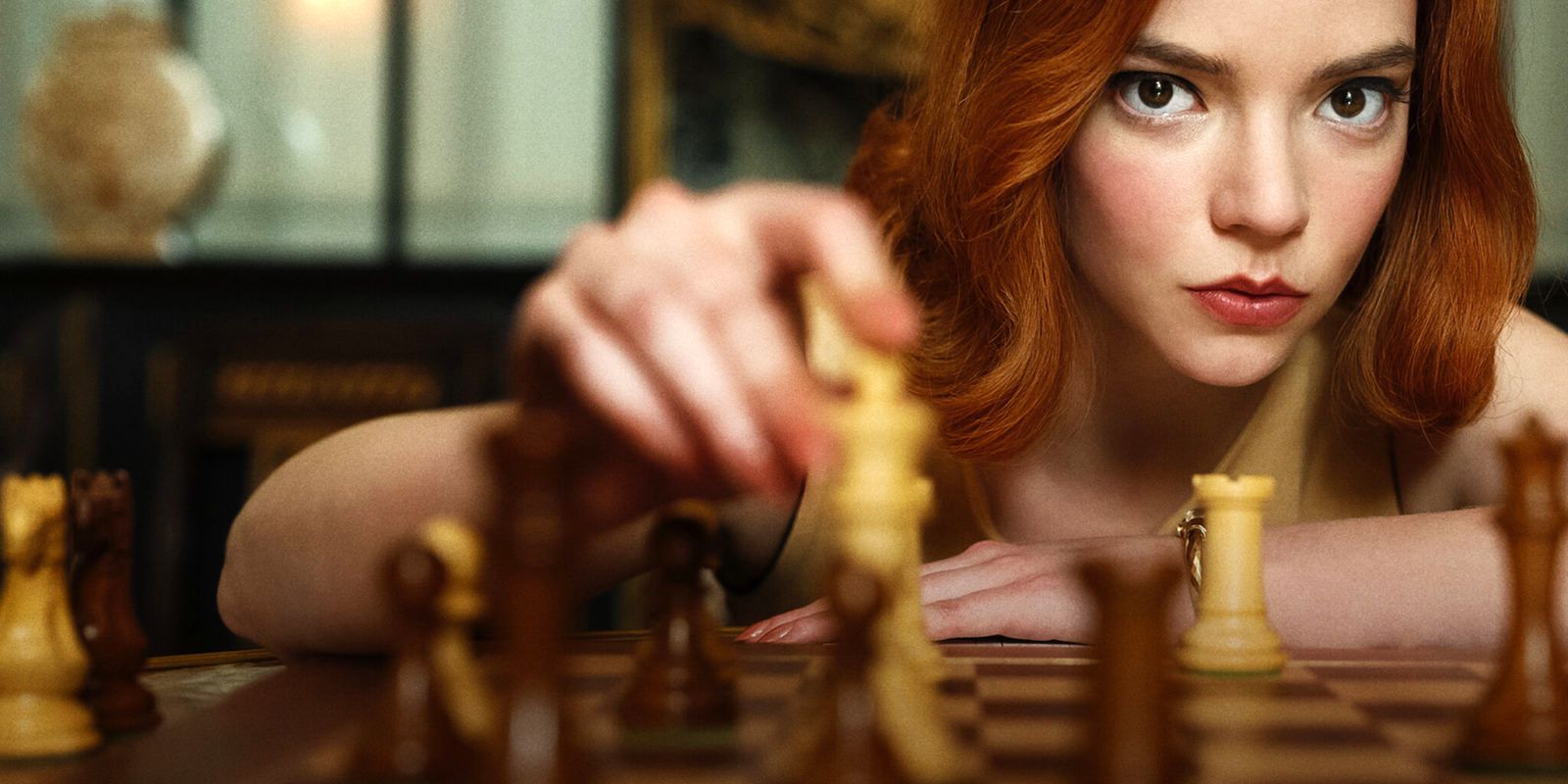 Beth making a chess move in Queen's Gambit.