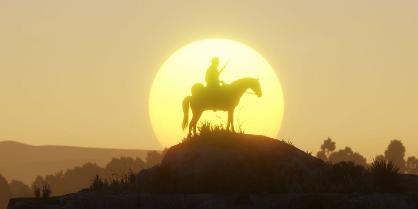 Arthur Morgan sits on a horse in front of a sunset in Red Dead Redemption 2