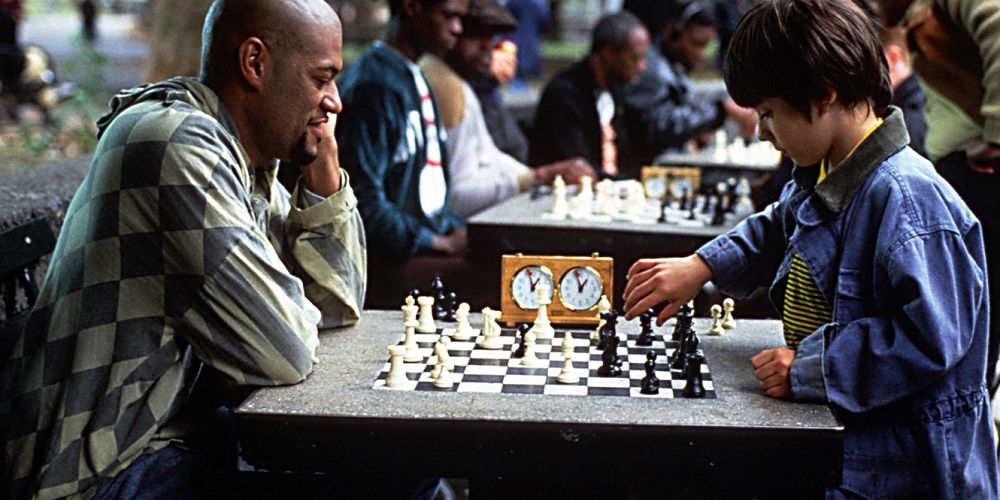 Vinnie (Laurence Fishburne) and Josh (Max Pomeranc) playing chess in Searching for Bobby Fisher