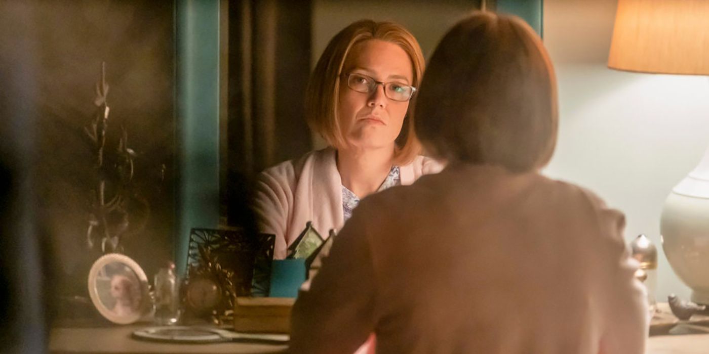 Rebecca staring at herself in the mirror in a scene from This Is Us.