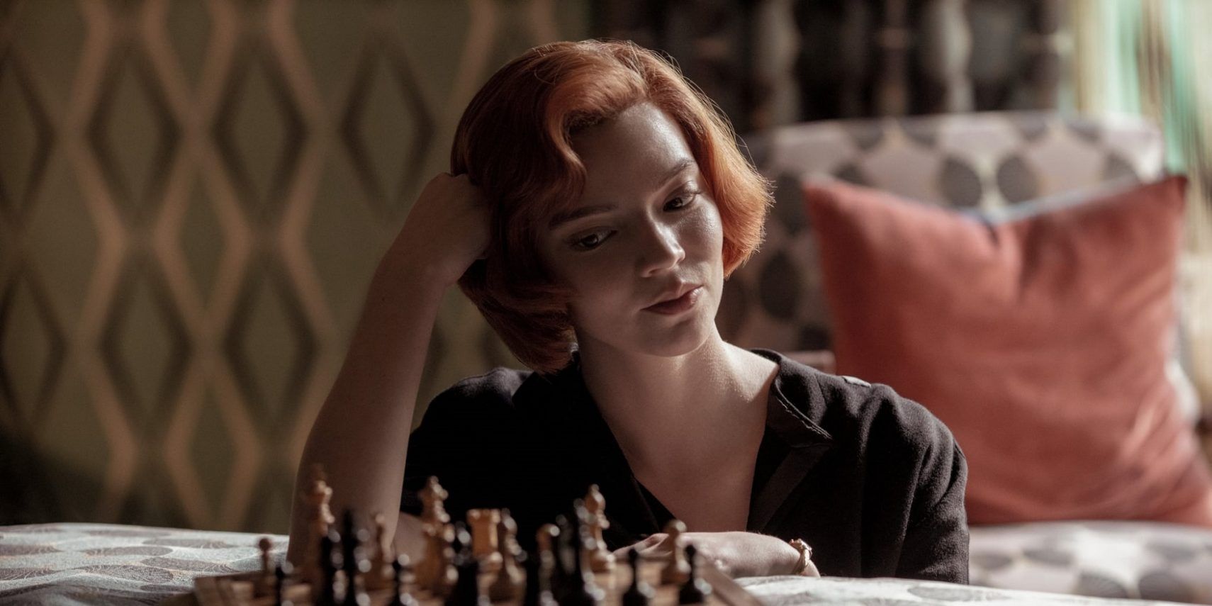 Beth playing chess in The Queen's Gambit.