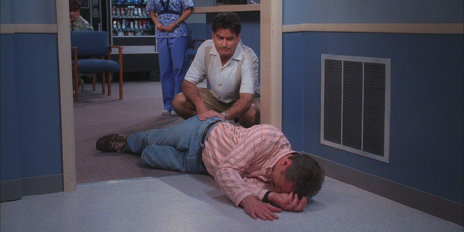 Charlie with Herb laying on the floor in Two and a Half Men