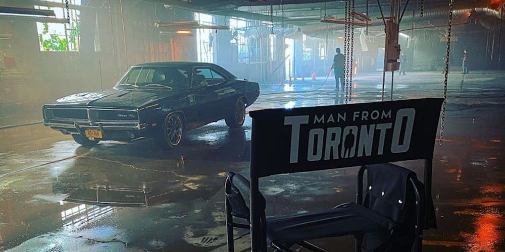 Set photo of a director's chair and a muscle car in The Man From Toronto