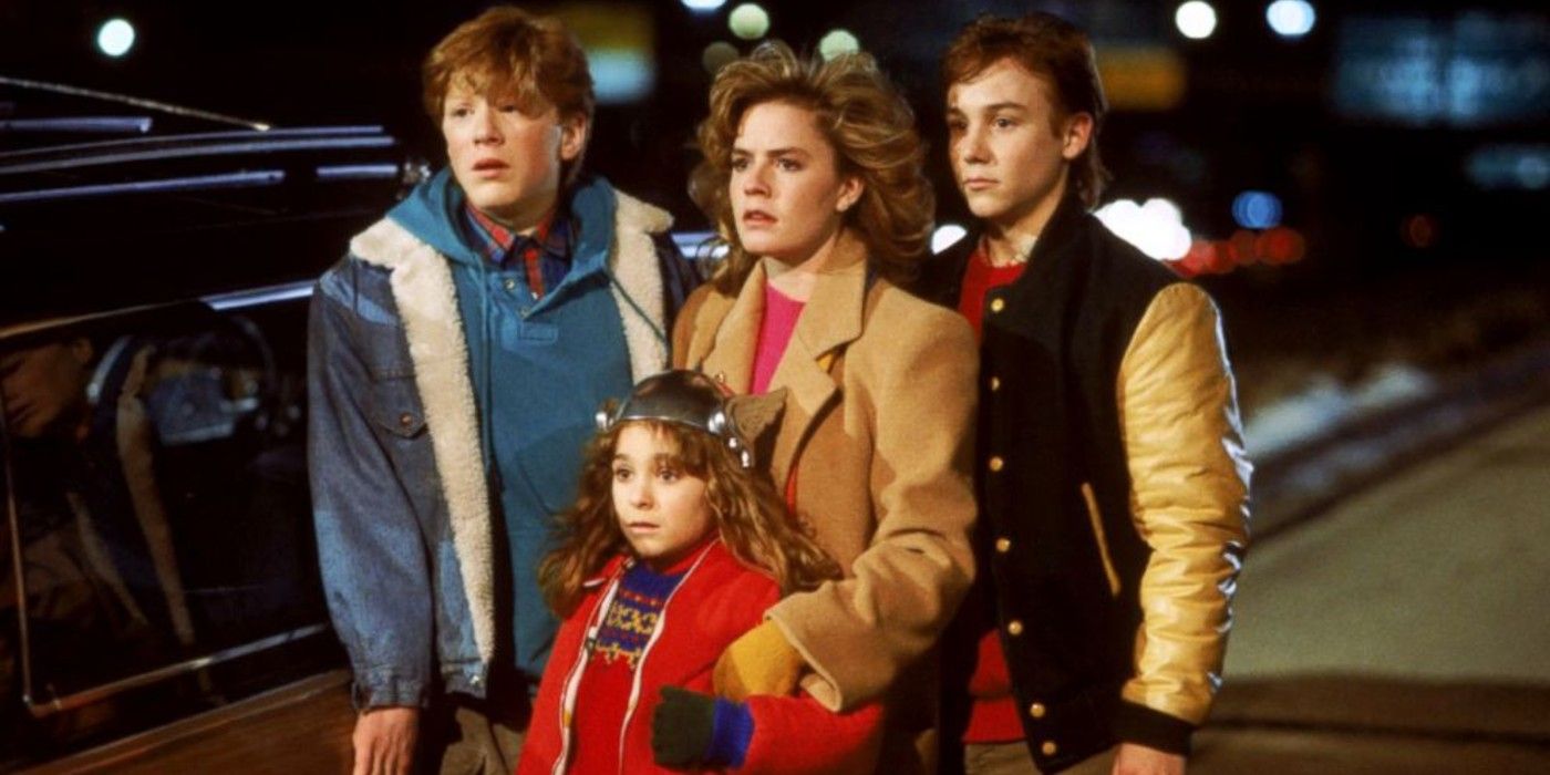 Adventures in Babysitting cast standing outside looking in the distance.