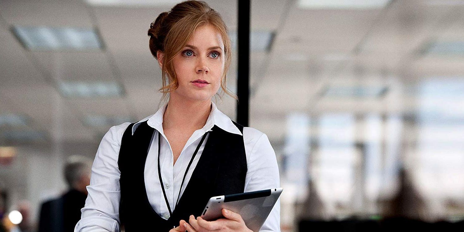 Lois Lane holding a notepad and looking serious