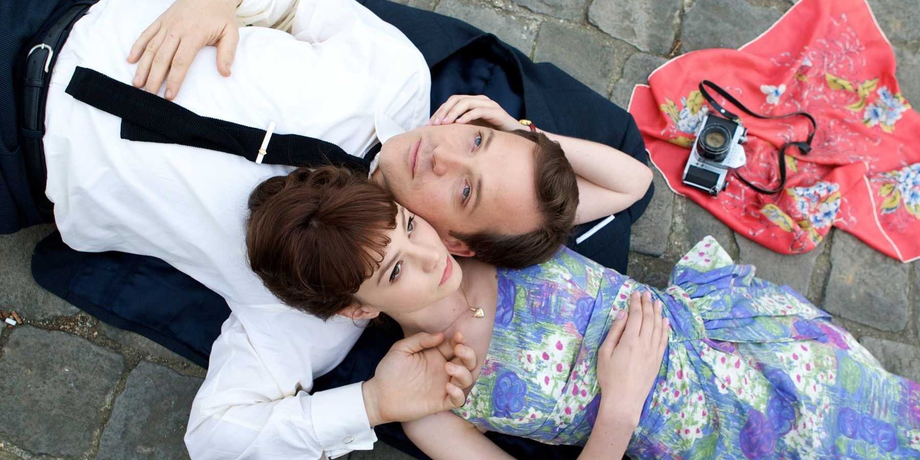 Carey Mulligan and Peter Sarsgaard lie on a stone path together in An Education