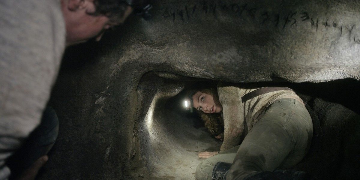 A woman crawling through a cave in As Above, So Below